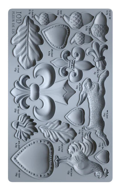 Decorative silicone mold with various shapes and measurements on a gray background