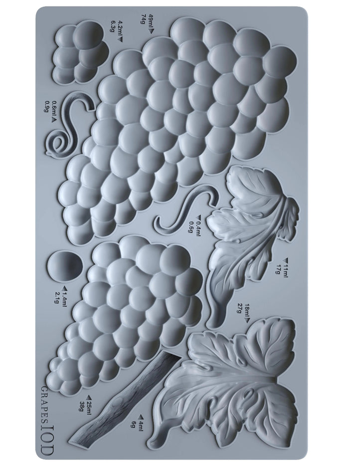 Silicone mold with grape and leaf design on a gray background
