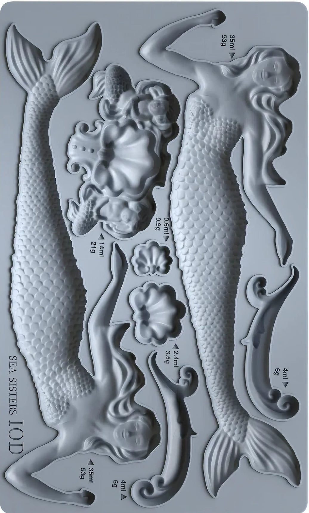 Metallic mold with mermaid and shell designs on a gray background