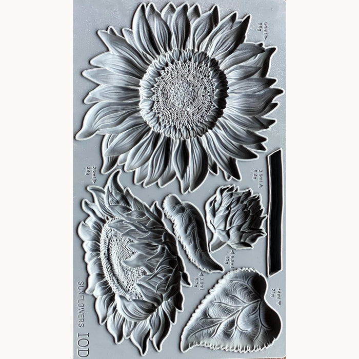 Clear stamp set with sunflower and leaf designs on a gray background