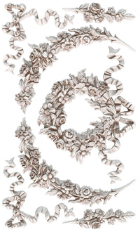 Decorative floral and ribbon elements on a white background