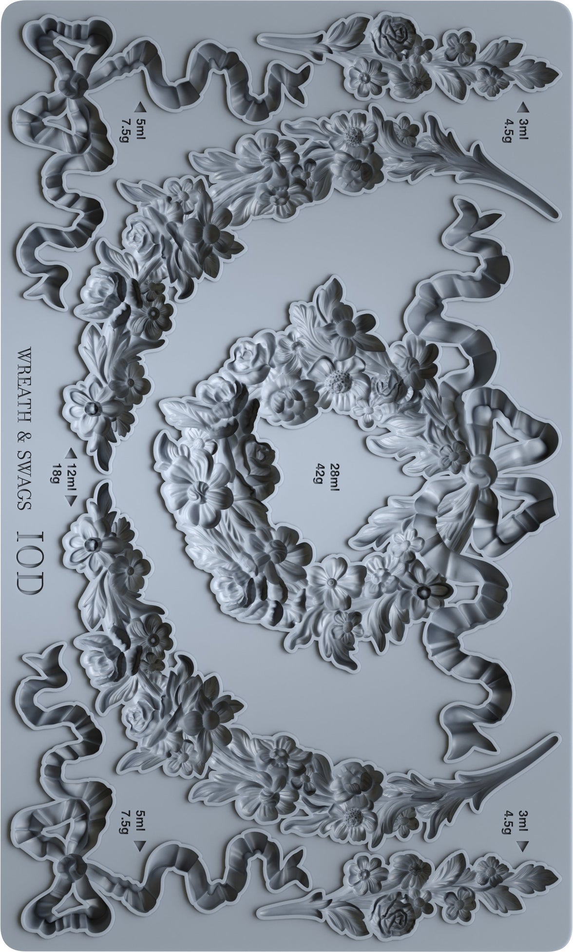 Decorative mold with wreath and swag designs on a gray background