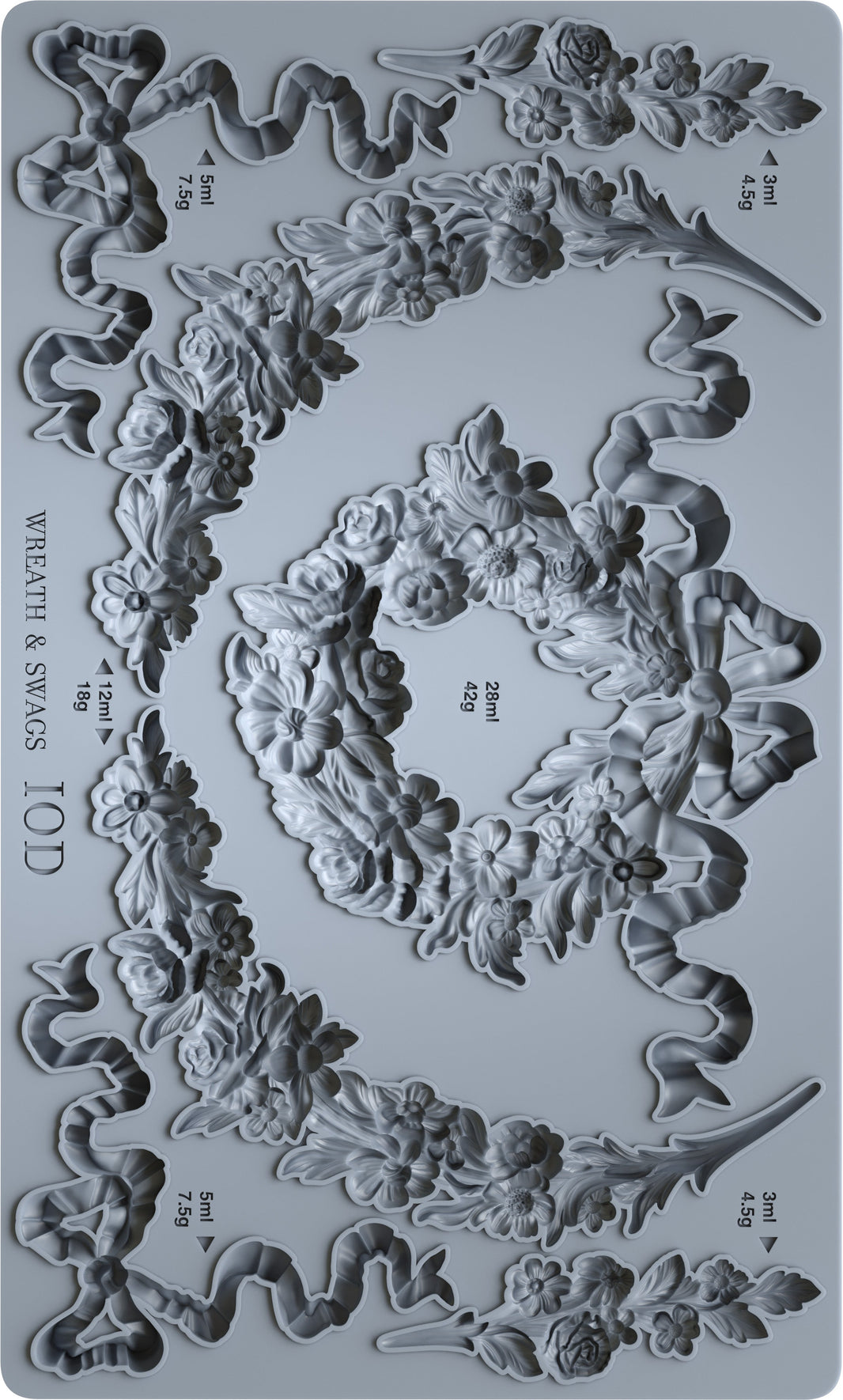 Decorative mold with wreath and swag designs on a gray background
