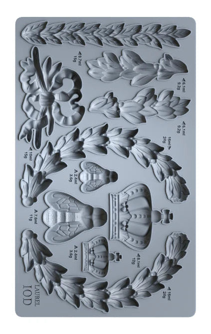 Silicone mold with floral and crown designs on a gray background