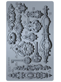 Decorative silicone mold with intricate designs on a gray background