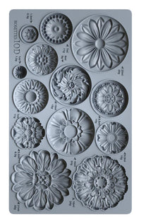 Silicone mold with floral designs on a gray background