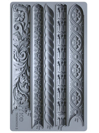 Decorative mold with intricate patterns on a gray background