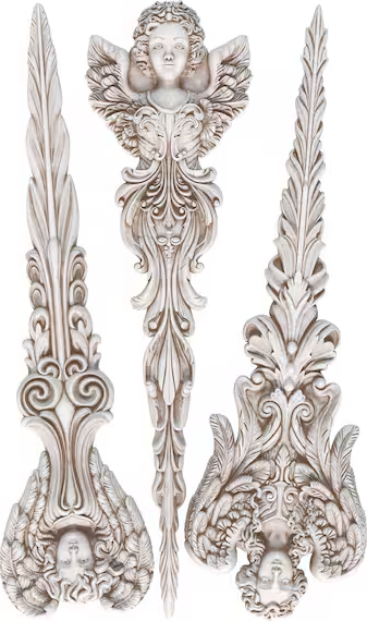 Decorative silver spoons with intricate designs on a white background