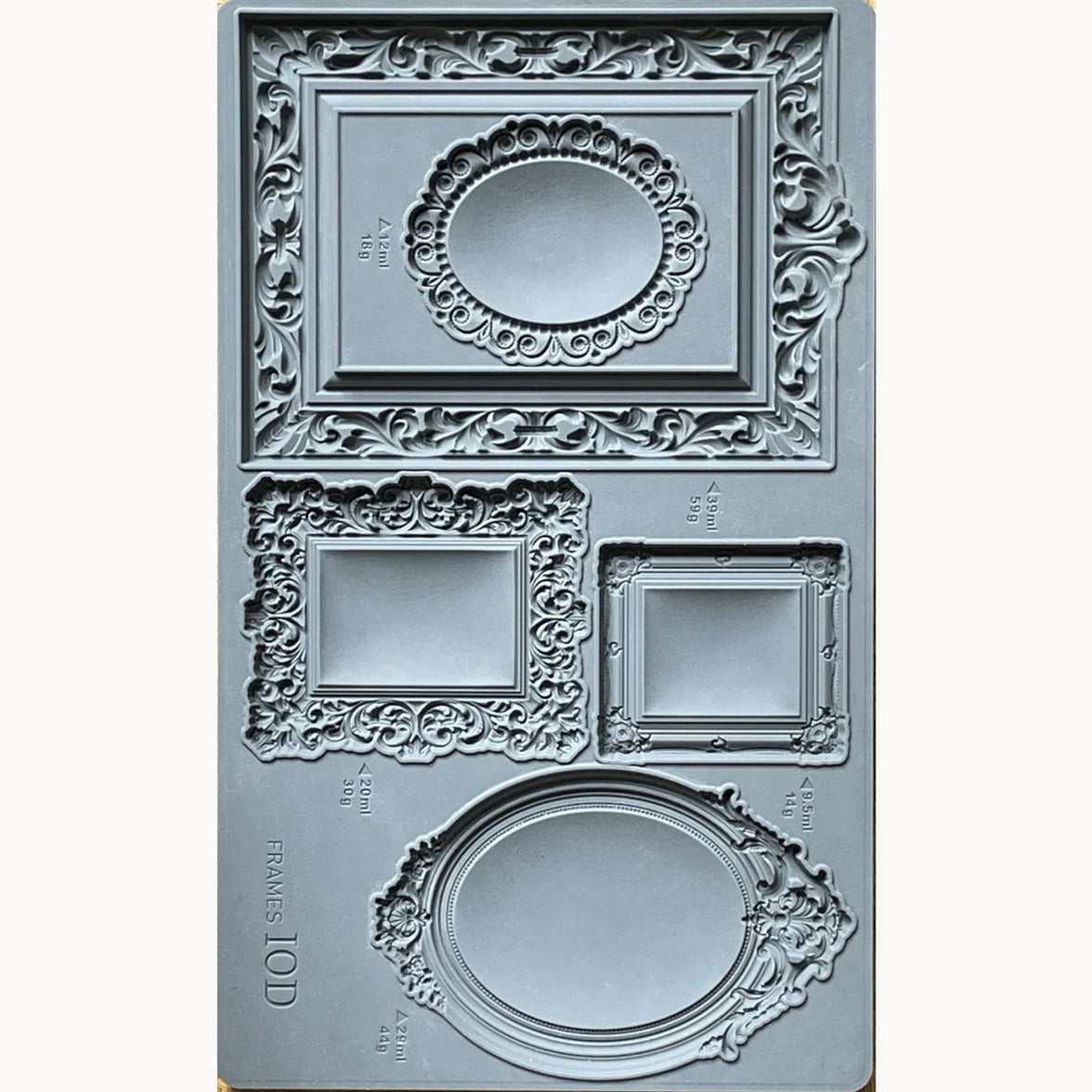 Decorative frame mold with intricate designs on a white background