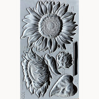 Clear stamp set with sunflower and leaf designs on a gray background